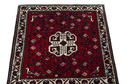 Surface texture of 2000s Shiraz rug with natural Wool and intricate pattern