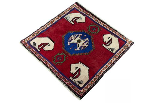 Corner detail of 2000s Shiraz rug showing border pattern and Wool pile