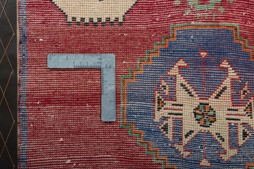 Backside of handmade 2000s Shiraz rug showing knot structure and weave density