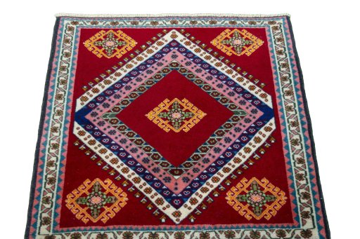 Surface texture of 2000s Shiraz rug with natural Wool and intricate pattern