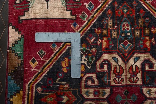 Backside of handmade 2000s Shiraz rug showing knot structure and weave density