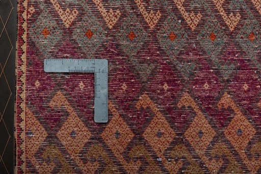 Backside of handmade 2000s Shiraz rug showing knot structure and weave density