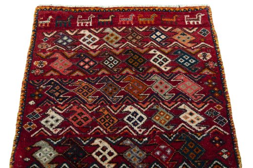 Surface texture of 2000s Shiraz rug with natural Wool and intricate pattern