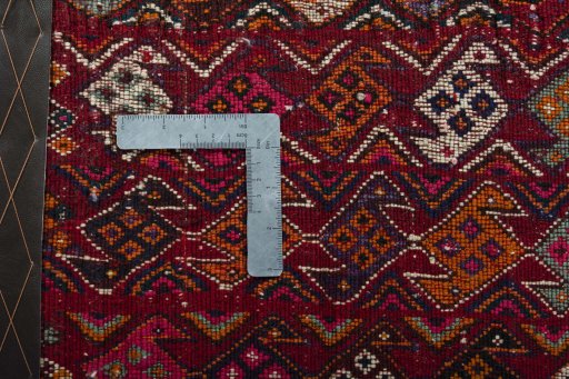 Backside of handmade 2000s Shiraz rug showing knot structure and weave density