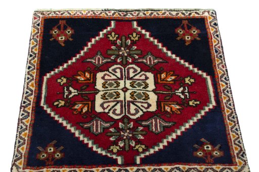 Surface texture of 2000s Shiraz rug with natural Wool and intricate pattern