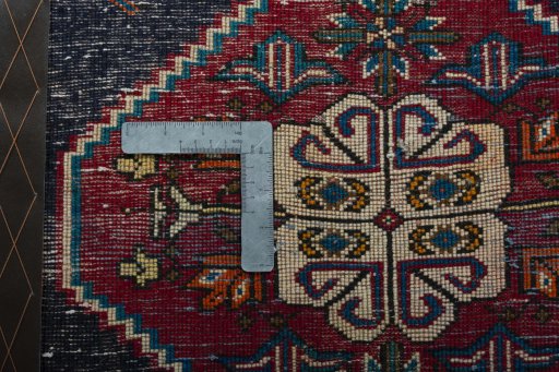 Backside of handmade 2000s Shiraz rug showing knot structure and weave density