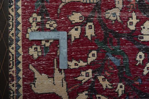Backside of handmade 2000s Shiraz rug showing knot structure and weave density