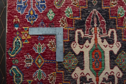 Backside of handmade 2000s Shiraz rug showing knot structure and weave density