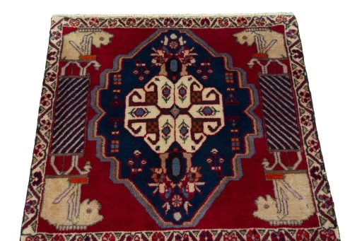Surface texture of 2000s Shiraz rug with natural Wool and intricate pattern