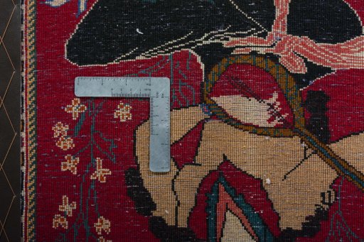 Backside of handmade 2000s Shiraz rug showing knot structure and weave density