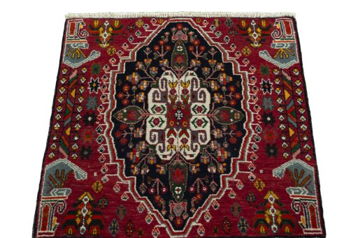 Surface texture of 2000s Shiraz rug with natural Wool and intricate pattern
