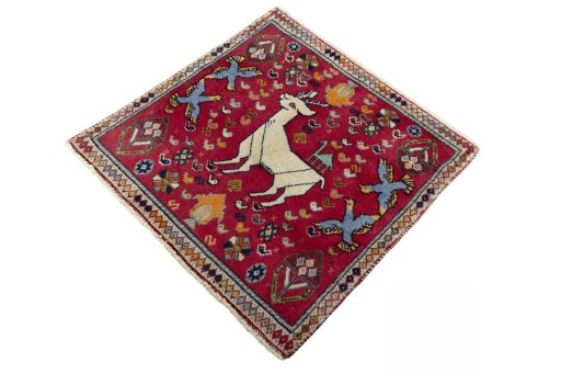 Corner detail of 2000s Shiraz rug showing border pattern and Wool pile