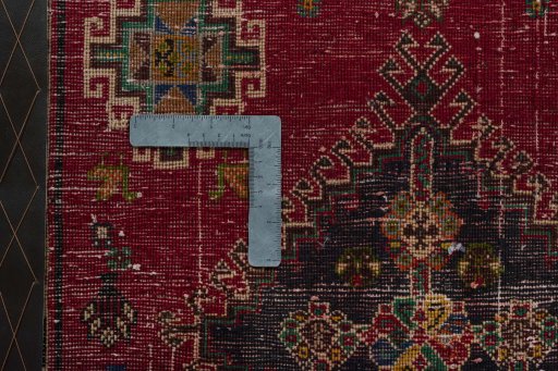 Backside of handmade 2000s Shiraz rug showing knot structure and weave density
