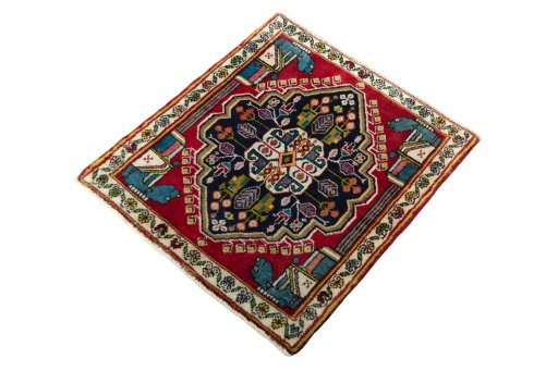 Corner detail of 2000s Shiraz rug showing border pattern and Wool pile