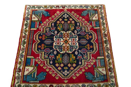 Surface texture of 2000s Shiraz rug with natural Wool and intricate pattern