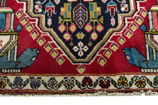 Backside of handmade 2000s Shiraz rug showing knot structure and weave density