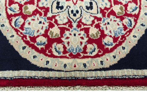 Backside of handmade 2000s Shiraz rug showing knot structure and weave density