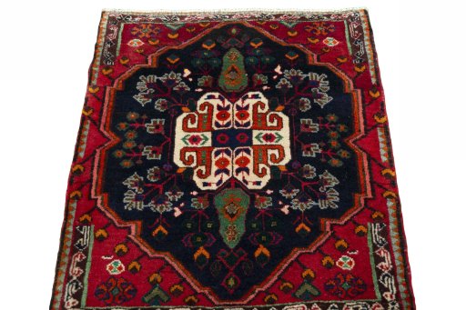 Surface texture of 2000s Shiraz rug with natural Wool and intricate pattern