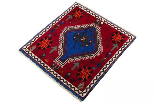 Corner detail of 2000s Shiraz rug showing border pattern and Wool pile