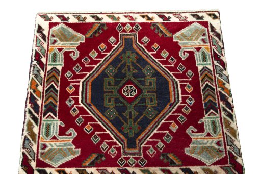 Surface texture of 2000s Shiraz rug with natural Wool and intricate pattern