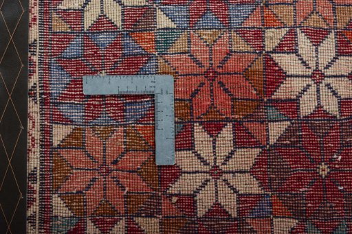 Backside of handmade 2000s Shiraz rug showing knot structure and weave density