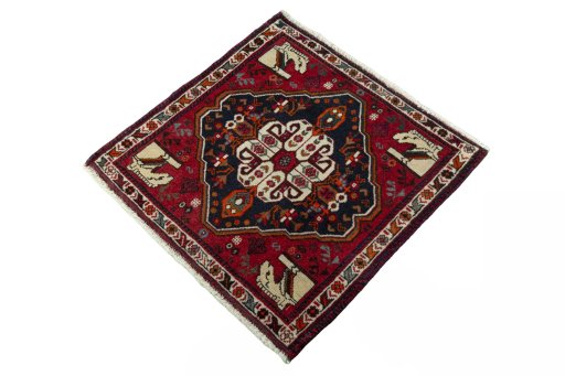 Corner detail of 2000s Shiraz rug showing border pattern and Wool pile