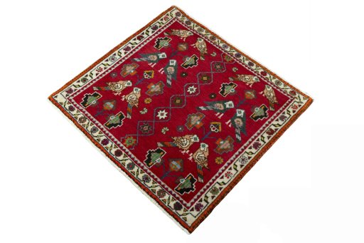 Corner detail of 2000s Shiraz rug showing border pattern and Wool pile