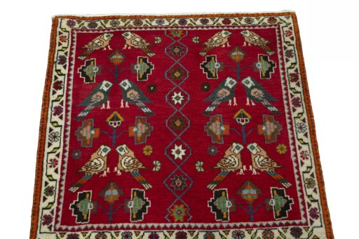 Surface texture of 2000s Shiraz rug with natural Wool and intricate pattern