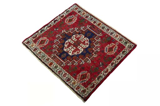 Corner detail of 2000s Shiraz rug showing border pattern and Wool pile