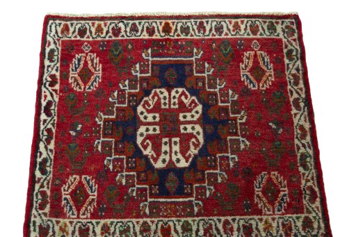 Surface texture of 2000s Shiraz rug with natural Wool and intricate pattern