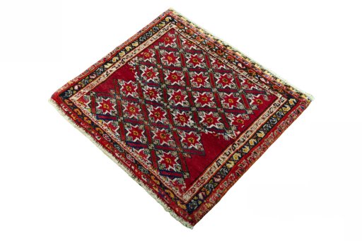 Corner detail of 2000s Shiraz rug showing border pattern and Wool pile