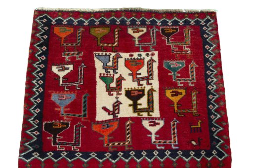 Surface texture of 2000s Shiraz rug with natural Wool and intricate pattern