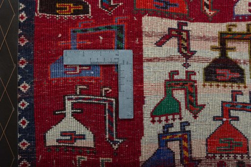 Backside of handmade 2000s Shiraz rug showing knot structure and weave density