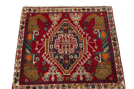 Surface texture of 2000s Shiraz rug with natural Wool and intricate pattern