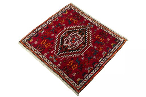 Corner detail of 2000s Shiraz rug showing border pattern and Wool pile