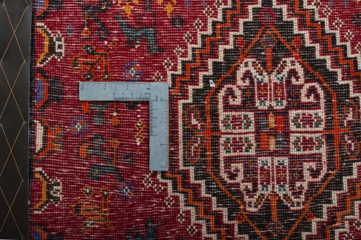 Backside of handmade 2000s Shiraz rug showing knot structure and weave density