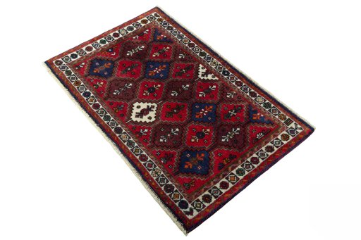Corner detail of 2000s Shiraz rug showing border pattern and Wool pile