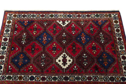 Surface texture of 2000s Shiraz rug with natural Wool and intricate pattern