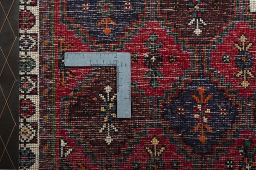 Backside of handmade 2000s Shiraz rug showing knot structure and weave density