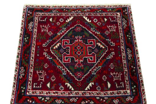 Surface texture of 2000s Shiraz rug with natural Wool and intricate pattern