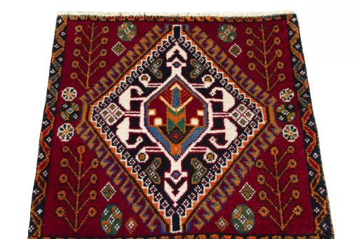 Surface texture of 2000s Shiraz rug with natural Wool and intricate pattern