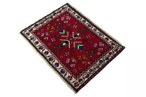 Corner detail of 2000s Shiraz rug showing border pattern and Wool pile