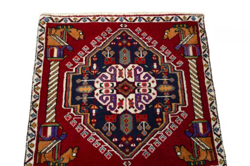 Surface texture of 2000s Shiraz rug with natural Wool and intricate pattern