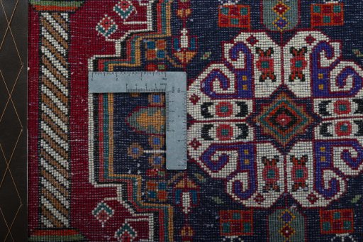 Backside of handmade 2000s Shiraz rug showing knot structure and weave density