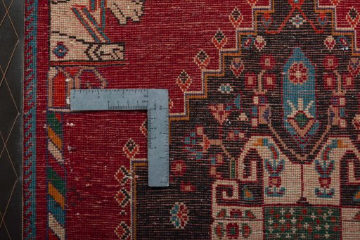 Backside of handmade 2000s Shiraz rug showing knot structure and weave density