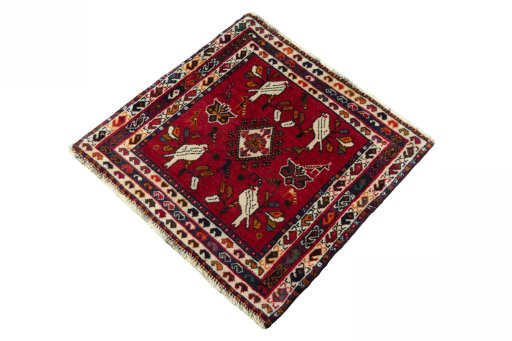 Corner detail of 2000s Shiraz rug showing border pattern and Wool pile