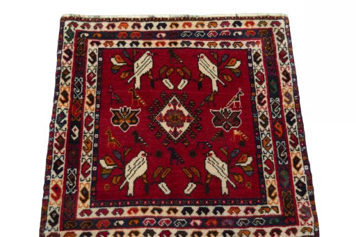 Surface texture of 2000s Shiraz rug with natural Wool and intricate pattern