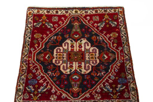 Surface texture of 2000s Shiraz rug with natural Wool and intricate pattern