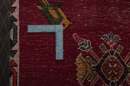 Backside of handmade 2000s Shiraz rug showing knot structure and weave density