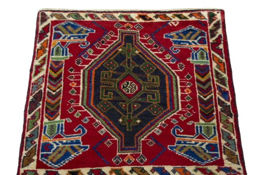 Surface texture of 2000s Shiraz rug with natural Wool and intricate pattern
